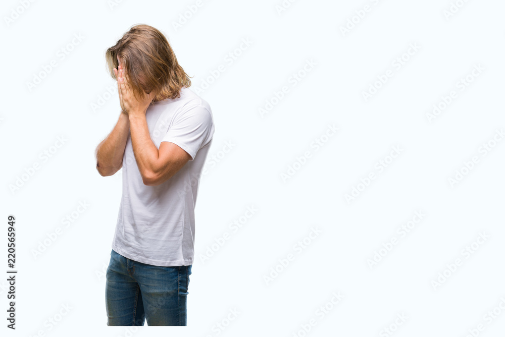 Young handsome man with long hair wearing glasses over isolated background with sad expression covering face with hands while crying. Depression concept. Young handsome man with long hair wearing glasses over isolated background with sad expression covering face with hands while crying. Depression concept.