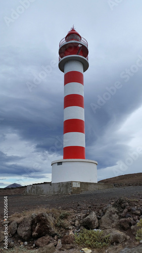 Red and white lighthouse, Faro de Punta Sardina in Gran Canaria, Spain