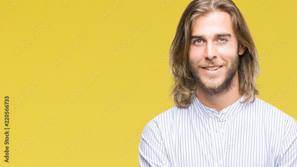 Young handsome man with long hair over isolated background happy face smiling with crossed arms looking at the camera. Positive person. Young handsome man with long hair over isolated background happy face smiling with crossed arms looking at the camera. Positive person.