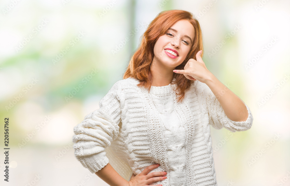Young beautiful woman over isolated background wearing winter sweater smiling doing phone gesture with hand and fingers like talking on the telephone. Communicating concepts. Young beautiful woman over isolated background wearing winter sweater smiling doing phone gesture with hand and fingers like talking on the telephone. Communicating concepts.