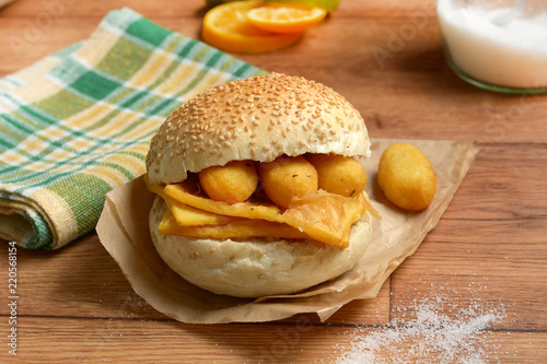 sandwich with panelle - traditional street food of Sicily - made with chickpea flour photo