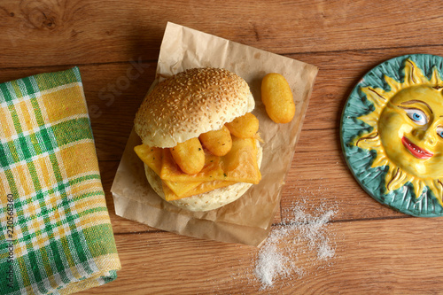 sandwich with panelle - traditional street food of Sicily - made with chickpea flour