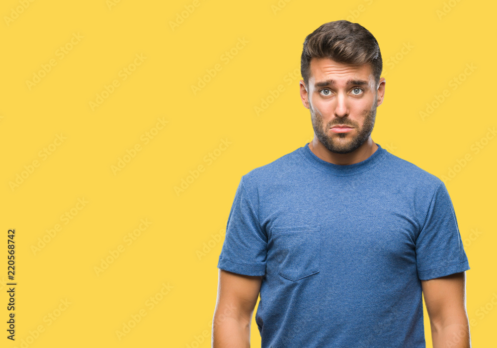 Young handsome man over isolated background depressed and worry for distress, crying angry and afraid. Sad expression.