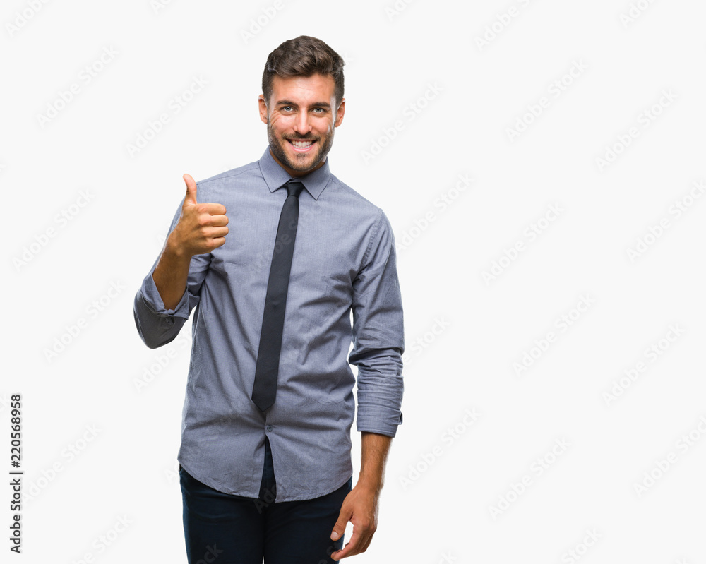 Young handsome business man over isolated background doing happy thumbs up gesture with hand. Approving expression looking at the camera with showing success. Young handsome business man over isolated background doing happy thumbs up gesture with hand. Approving expression looking at the camera with showing success.