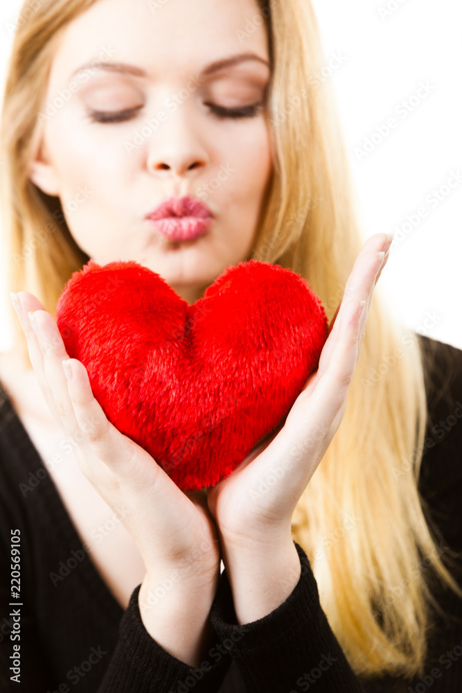 Woman holding red heart