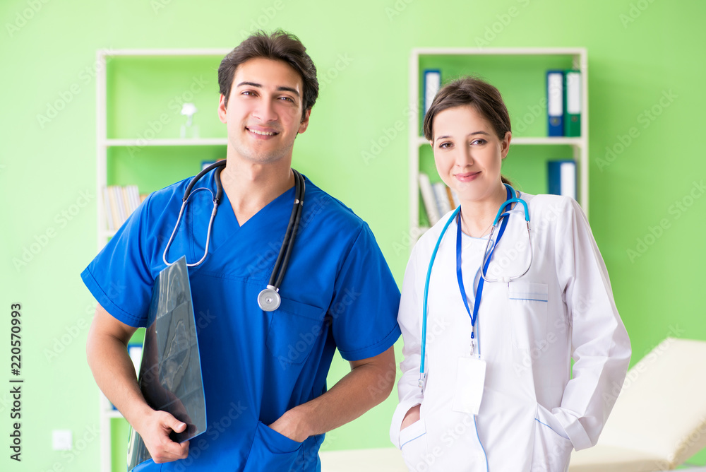 Woman and man doctors radiologists working at the clinic 