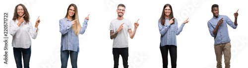 Group and team of young business people over isolated white background smiling and looking at the camera pointing with two hands and fingers to the side.