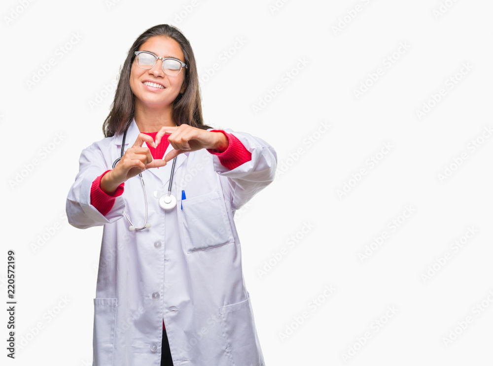 Young arab doctor woman over isolated background smiling in love showing heart symbol and shape with hands. Romantic concept. Young arab doctor woman over isolated background smiling in love showing heart symbol and shape with hands. Romantic concept.