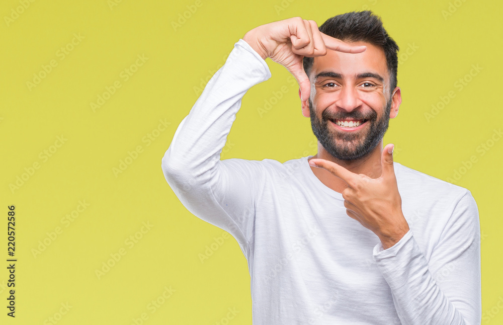 Adult hispanic man over isolated background smiling making frame with hands and fingers with happy face. Creativity and photography concept. Adult hispanic man over isolated background smiling making frame with hands and fingers with happy face. Creativity and photography concept.