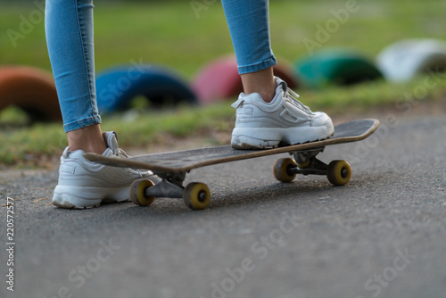 Low angle view of feet on a skateboard