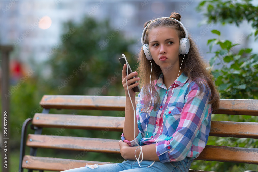 Thoughtful young woman pursing her lips