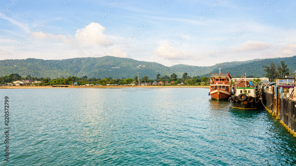 Wooden boat for dive tour docked at Nathon Pier near Nathon Beach with a peaceful sea atmosphere in the evening at Koh Samui island, Surat Thani province, Thailand, 16:9 widescreen Wooden boat for dive tour docked at Nathon Pier near Nathon Beach with a peaceful sea atmosphere in the evening at Koh Samui island, Surat Thani province, Thailand, 16:9 widescreen