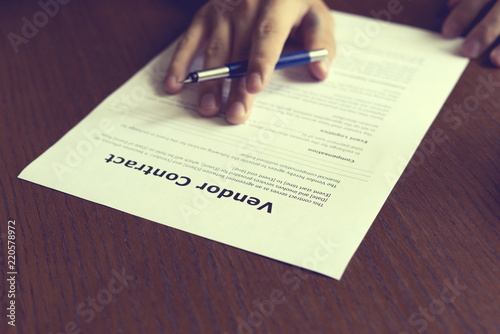 Vászonkép close up hand sign vendor contract on table for the new house, concept