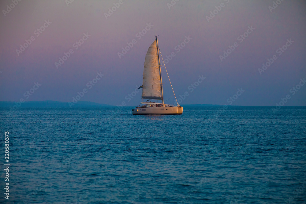 Catamaran yacht at sunset