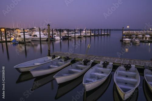 Belmar Marina in New Jersey at dawn, featuring boats on the foreground. Shot using long exposure