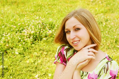 young woman relaxing in the grass 