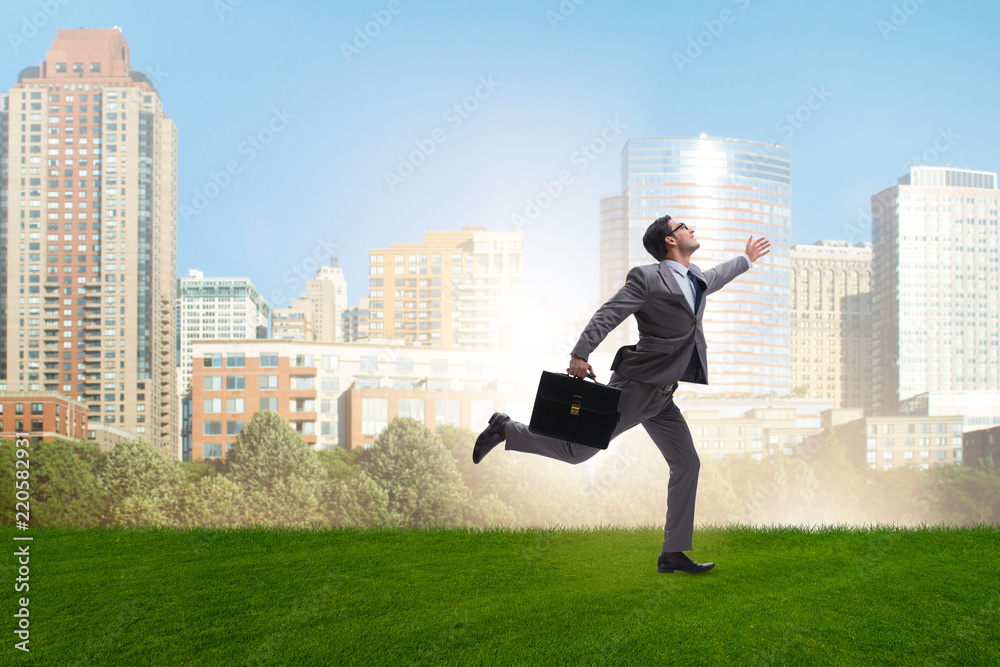 Happy businessman running towards his goal Happy businessman running towards his goal