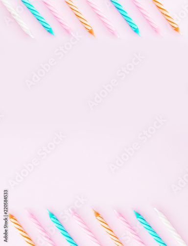 Birthday candles on pink background.