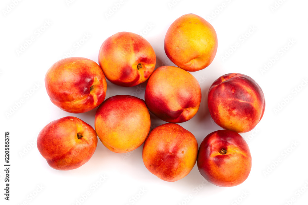 ripe nectarine with leaves isolated on white background. Top view. Flat lay pattern ripe nectarine with leaves isolated on white background. Top view. Flat lay pattern
