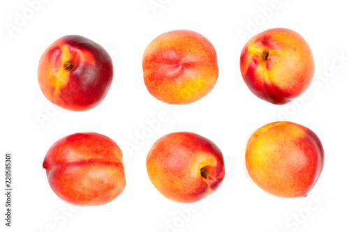 ripe nectarine with leaves isolated on white background. Top view. Flat lay pattern. Set or collection