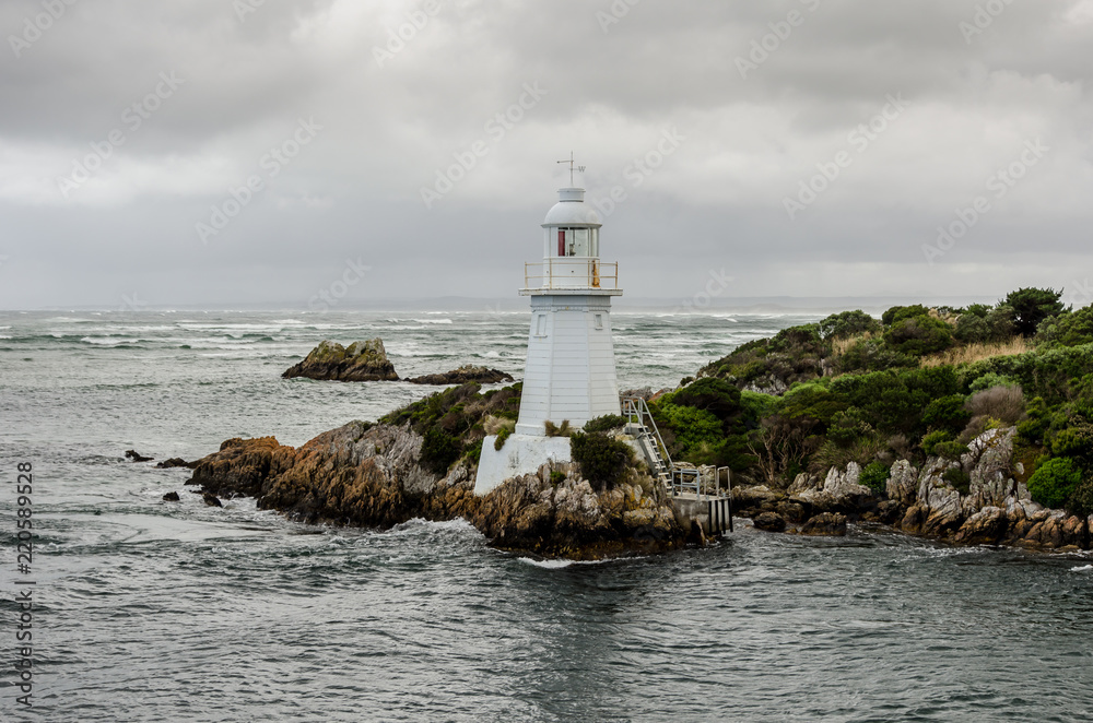 Hells Gate Lighthouse at the mouth of Macquarie Harbour on the west coast of Tasmania, Australia. 