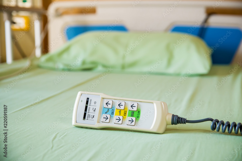 Hospital bed remote control place on the bed. technology of medical and