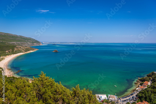 Fototapeta Naklejka Na Ścianę i Meble -  Amazing blue water beach in Arrábida, Alentejo in Portugal
