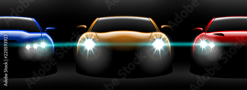 realistic red yellow blue three sport car view with unlocked headlights in the dark