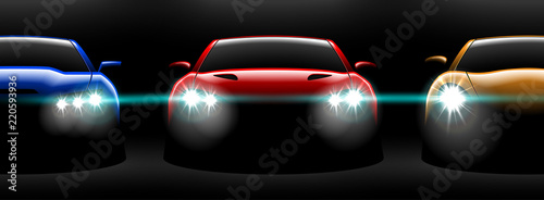 realistic red yellow blue three sport car view with unlocked headlights in the dark