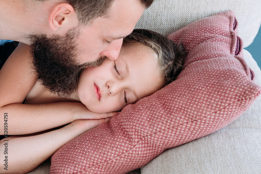 © golubovy - love and tenderness. caring father kissing his daughter goodnight. happy fatherhood and sweet family moments. © golubovy - love and tenderness. caring father kissing his daughter goodnight. happy fatherhood and sweet family moments.