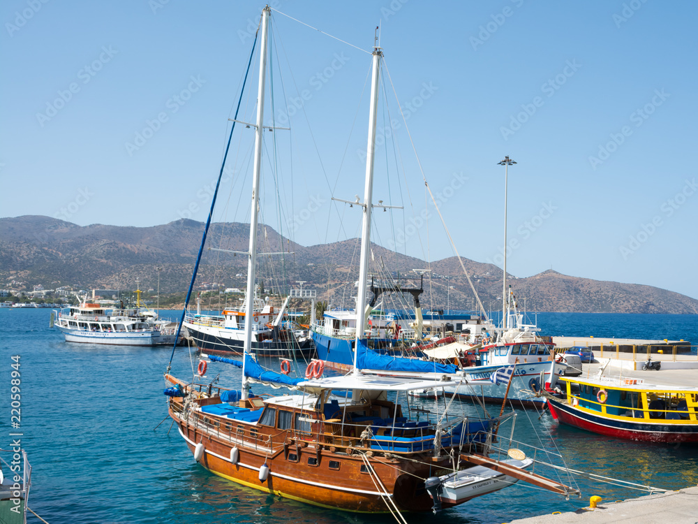 Agios Nikolaos. Crete. Ship at the pier on the waterfront Roussou Koundourou