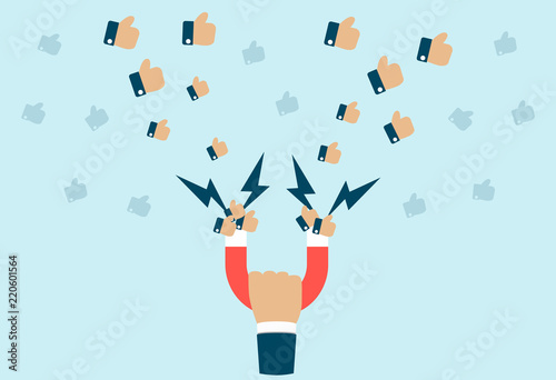 Businessman or internet marketer hand holding horseshoe magnet attract like engagement
