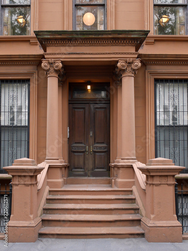 front steps to New York brownstone style apartment building photo