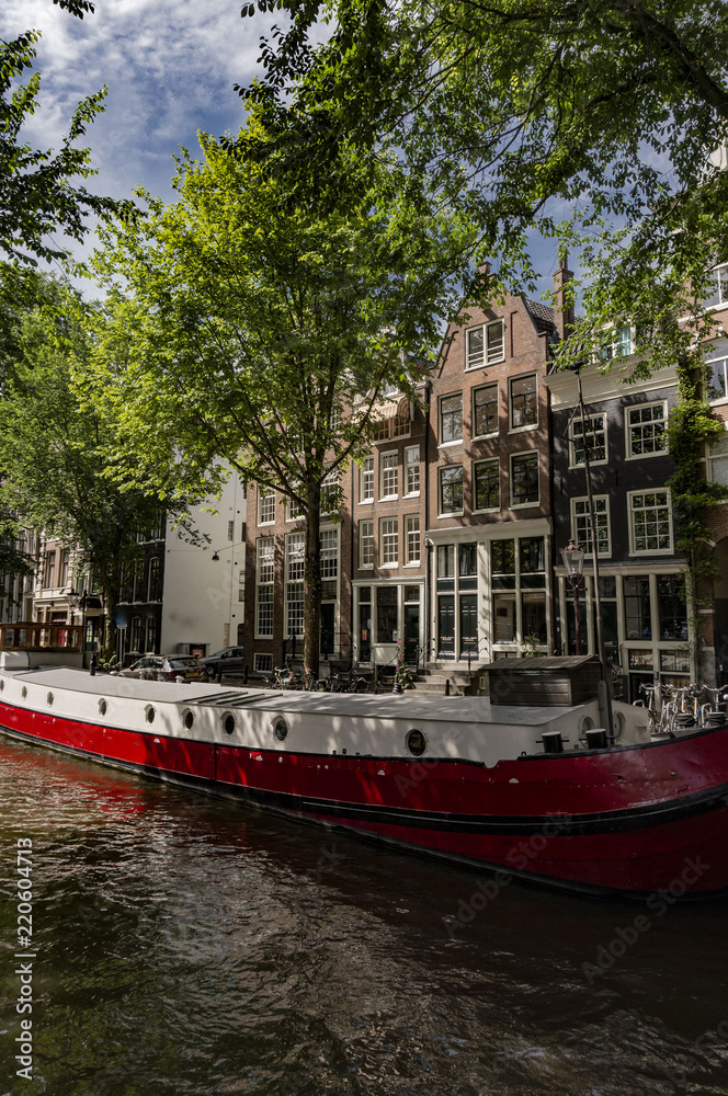 canal view with traditional buildings in Amsterdam, Netherlands