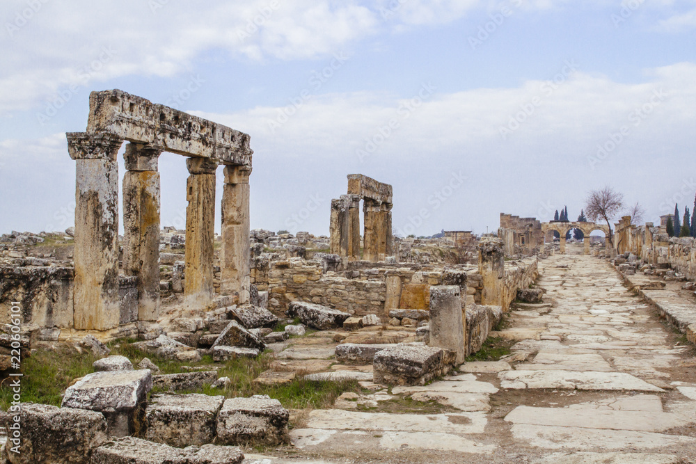 Columns and ruins of Hieropolis by a road in Pamukkale, Turkey