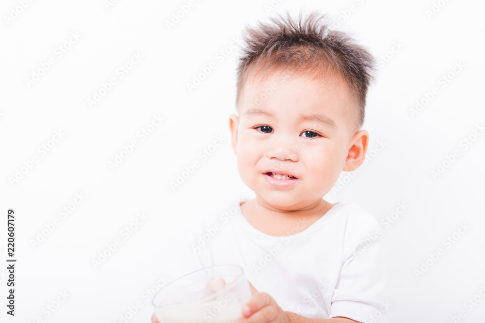 Asian portrait child boys 1 year 6 months drinking milk on glass Asian portrait child boys 1 year 6 months drinking milk on glass