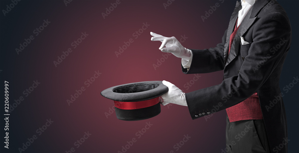 Illusionist white hand wants to conjure with magic wand from a black cylinder something - obrazy, fototapety, plakaty 