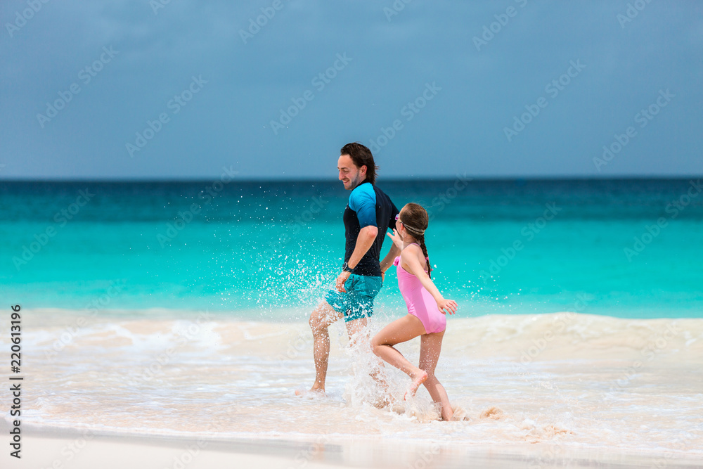 Father and daughter at beach