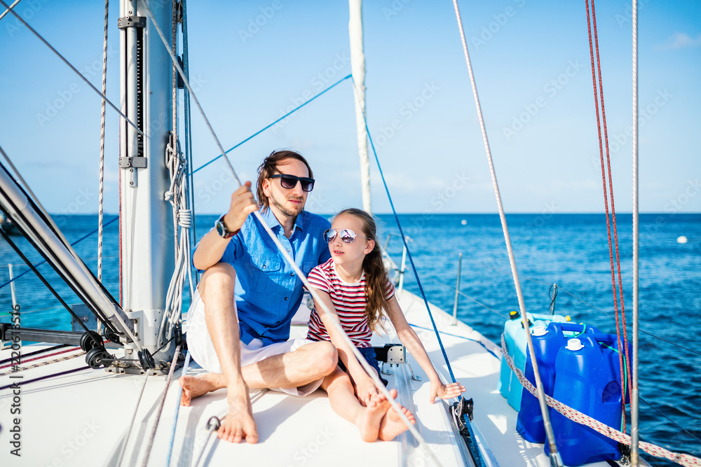 Family on board of sailing yacht Family on board of sailing yacht