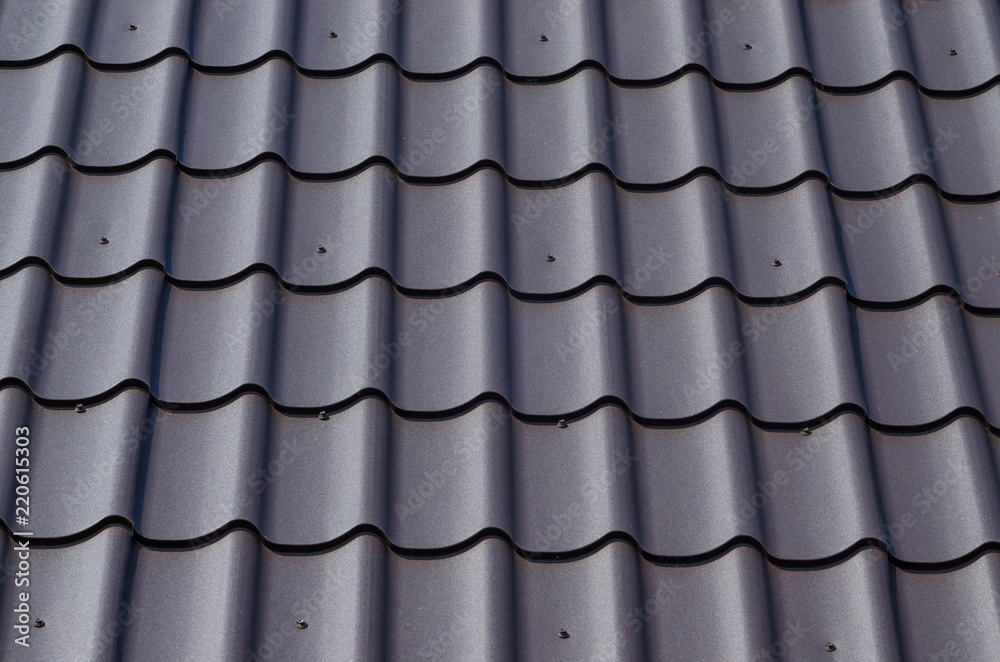 Slate roof as background. Metal tile roof surface, background, texture, abstract