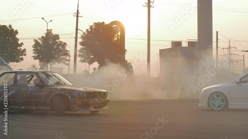 HD: Racing car enters into turn putting dust up. Slow motion photo