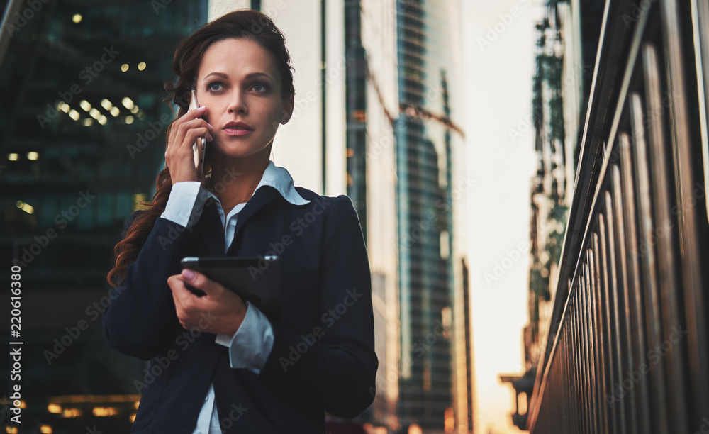 business woman talking on smartphone on the street business woman talking on smartphone on the street