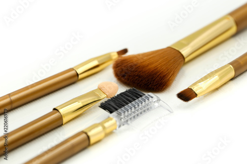 Makeup products with cosmetic on white background.