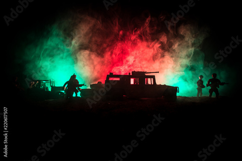 War Concept. Military silhouettes fighting scene on war fog sky background  World War Soldiers Silhouettes Below Cloudy Skyline At night. Attack scene. Army jeep vehicles with soldiers. army jeep