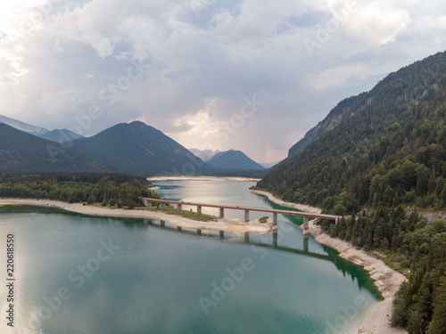 Aerial view on the lake Sylvenstein and bridge in the Alps of Bavaria in summer. Germany, august 2018