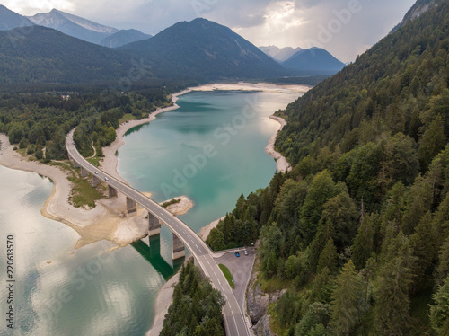 Fotografie Aerial view on the lake Sylvenstein and bridge in the Alps of Bavaria in summer