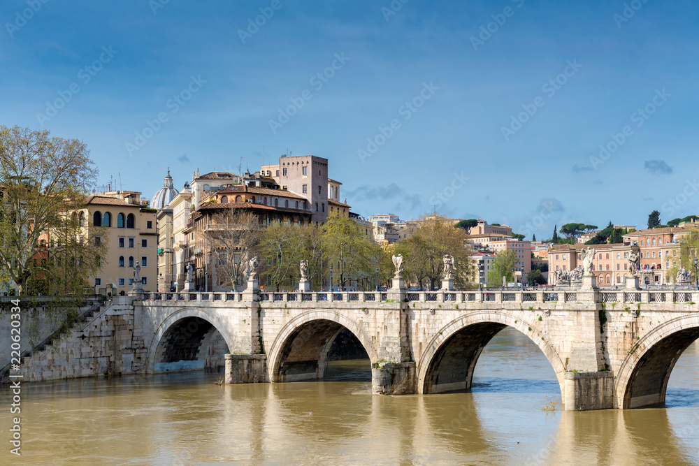 Rome downtown skyline with bridge on river Tiber at sunny day in Rome, Italy.