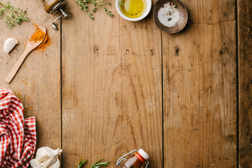 Spices and ingredients for cooking on wooden