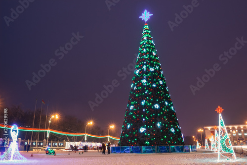 Big Christmas tree on city square at night