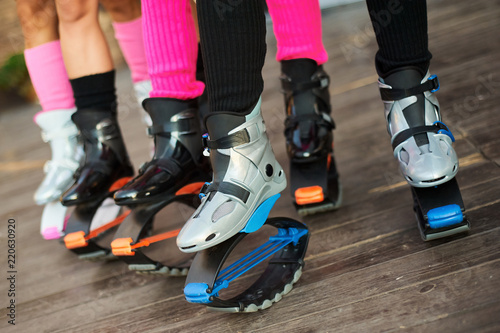 group of womens legs in kangoo jumps boots Photos | Adobe Stock
